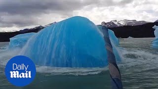 Extraordinary moment massive iceberg explodes next to boat [upl. by Yehus532]